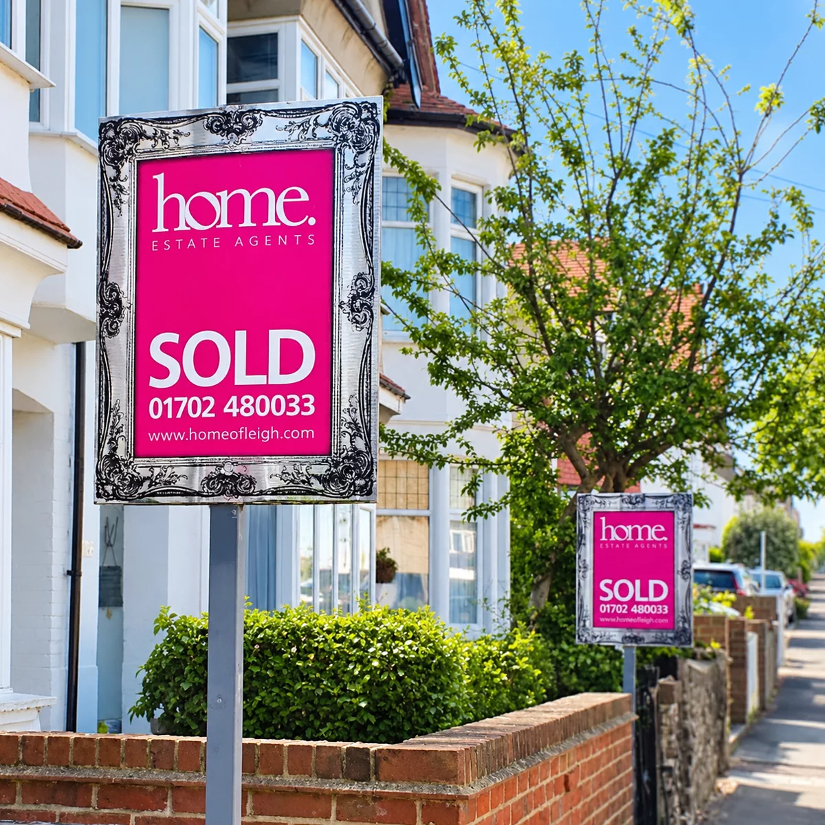 A Home Estate Agents sold board with a mirrored frame surround