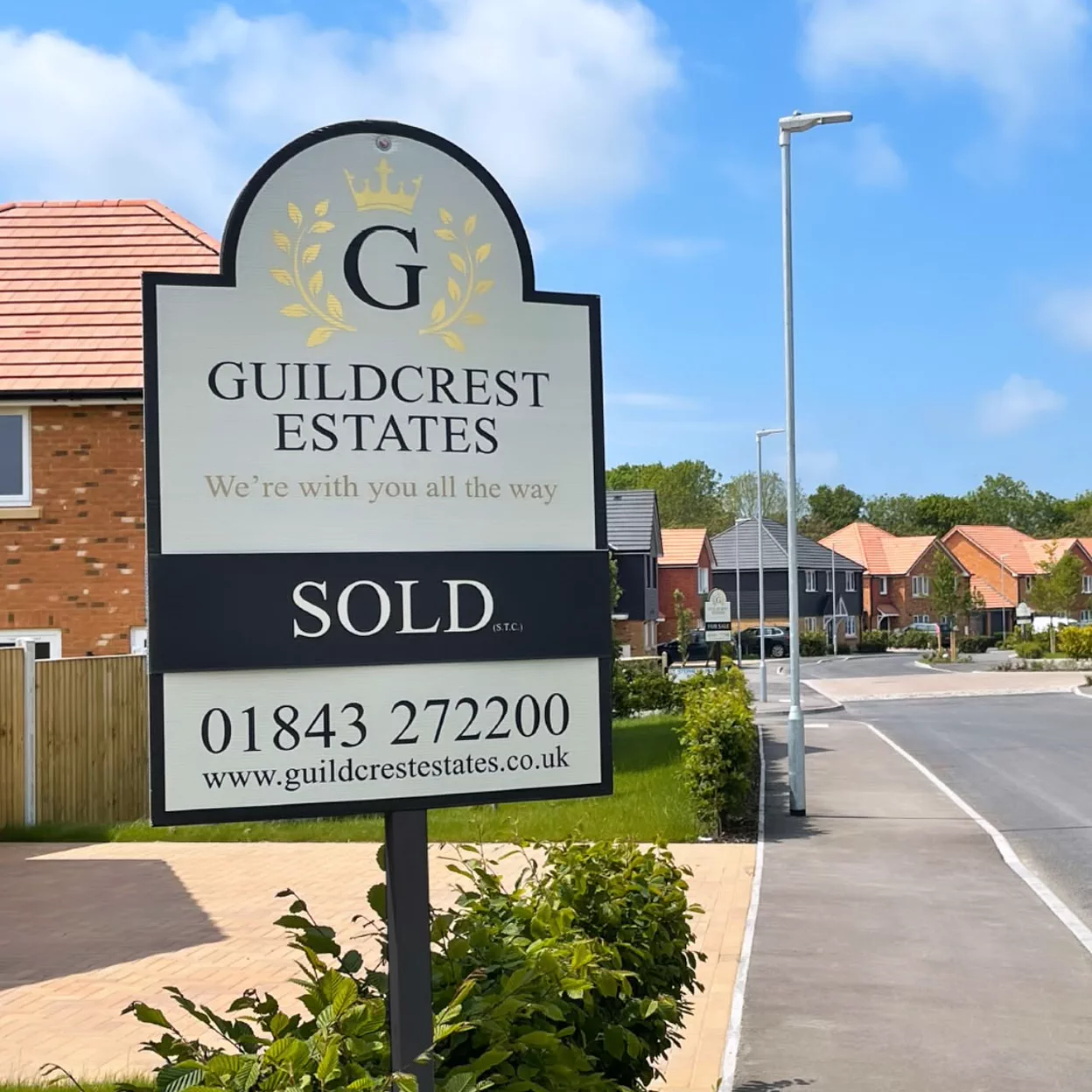 A Guildcrest Estates sold board with a silver mirrored finish