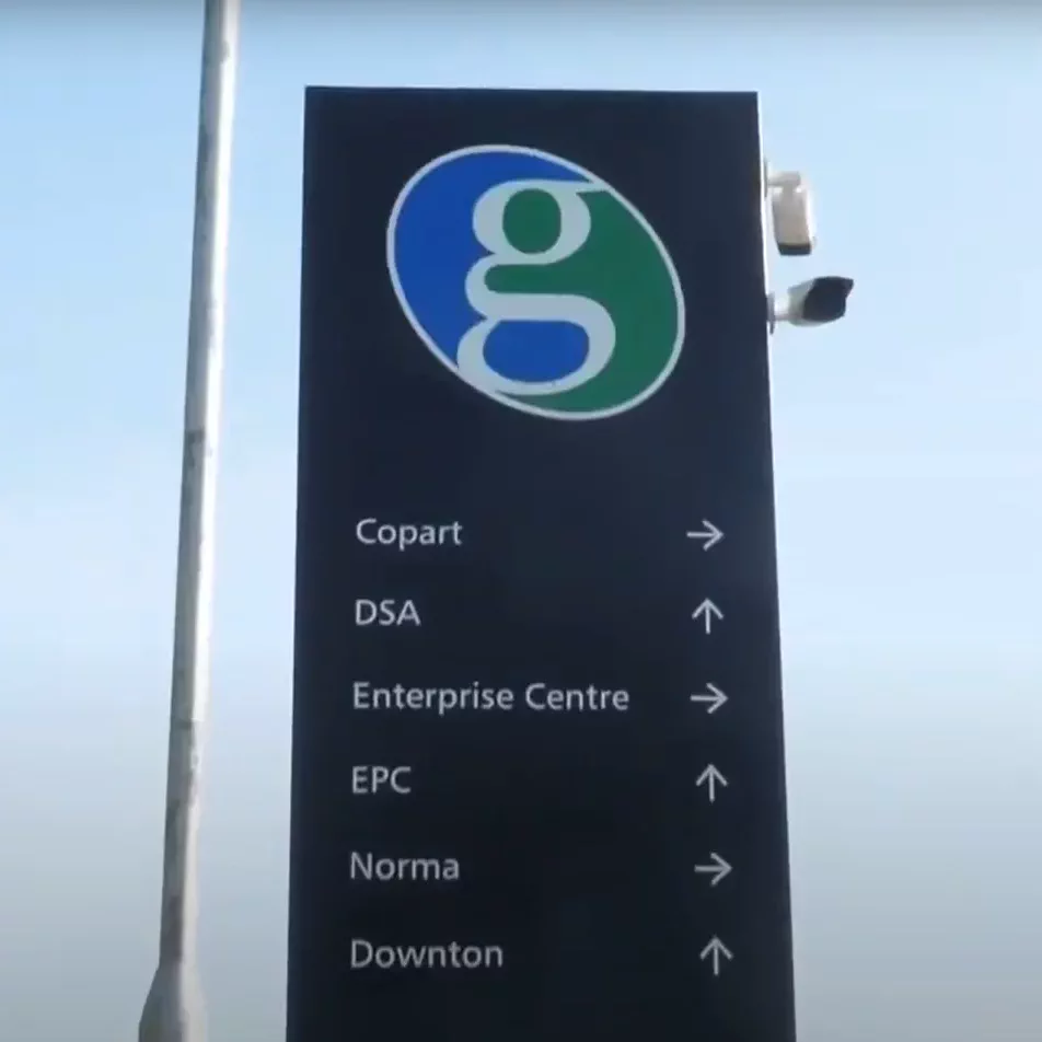 A branded totem sign outside an office
