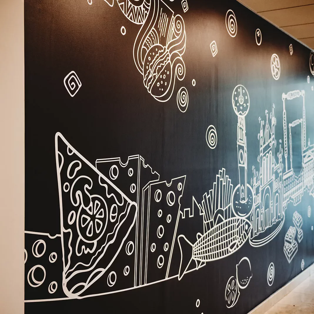 A large format wall graphic in a meeting room